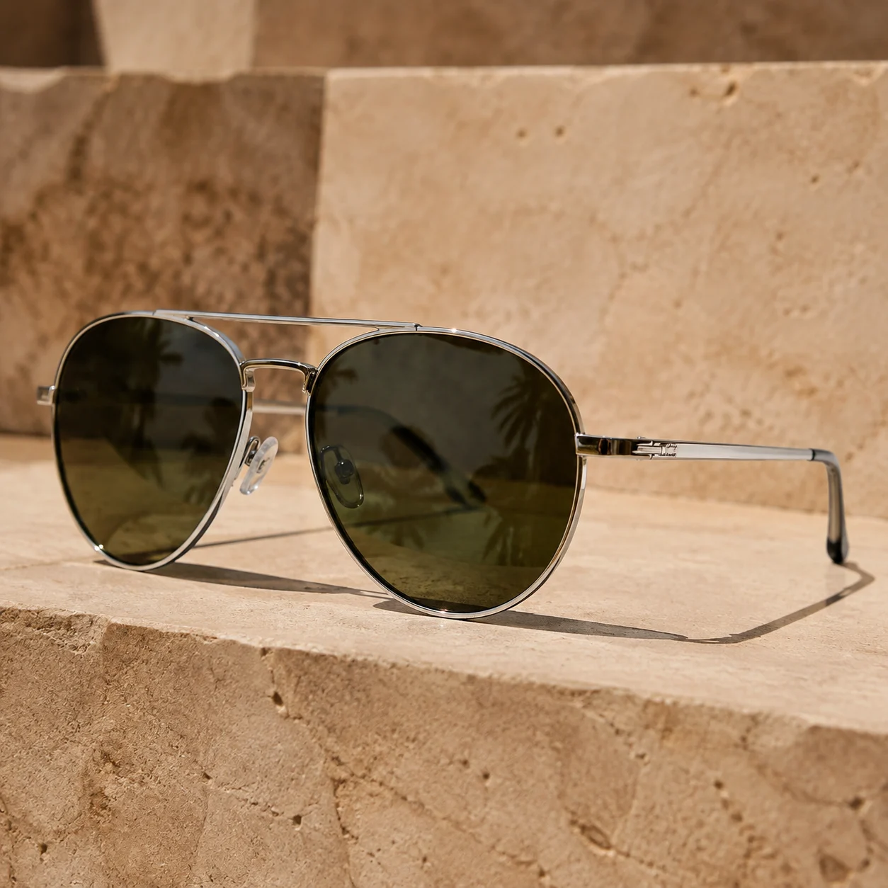 Chrome aviator sunglasses in architectural sunlight